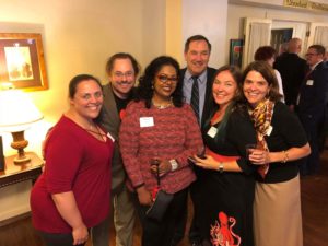 Party members socializing at a dinner event